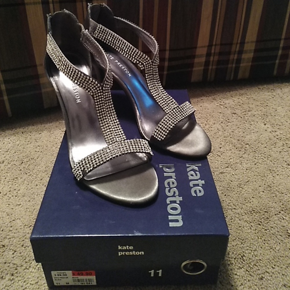 Silver and rhinestone open toe heels.